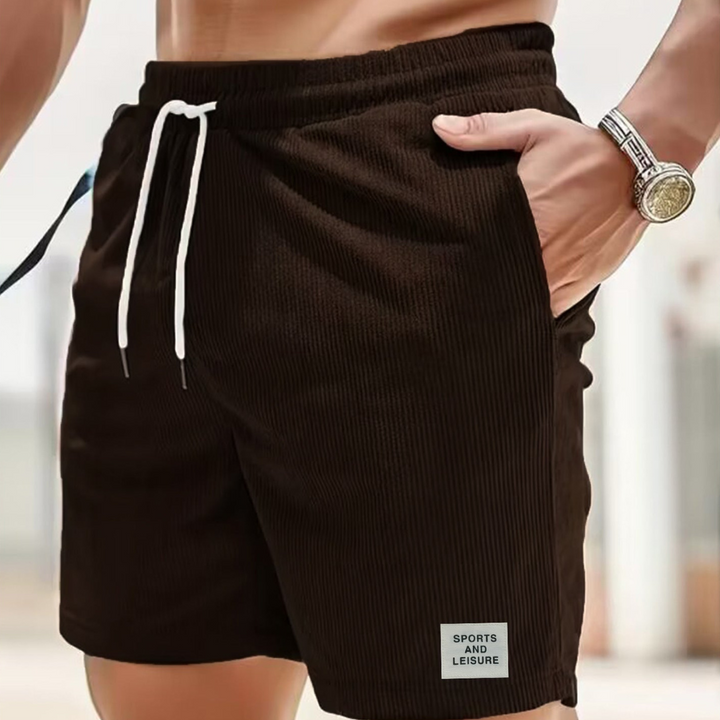 Athletic men's shorts, ribbed texture, drawstring for a secure fit during activities.