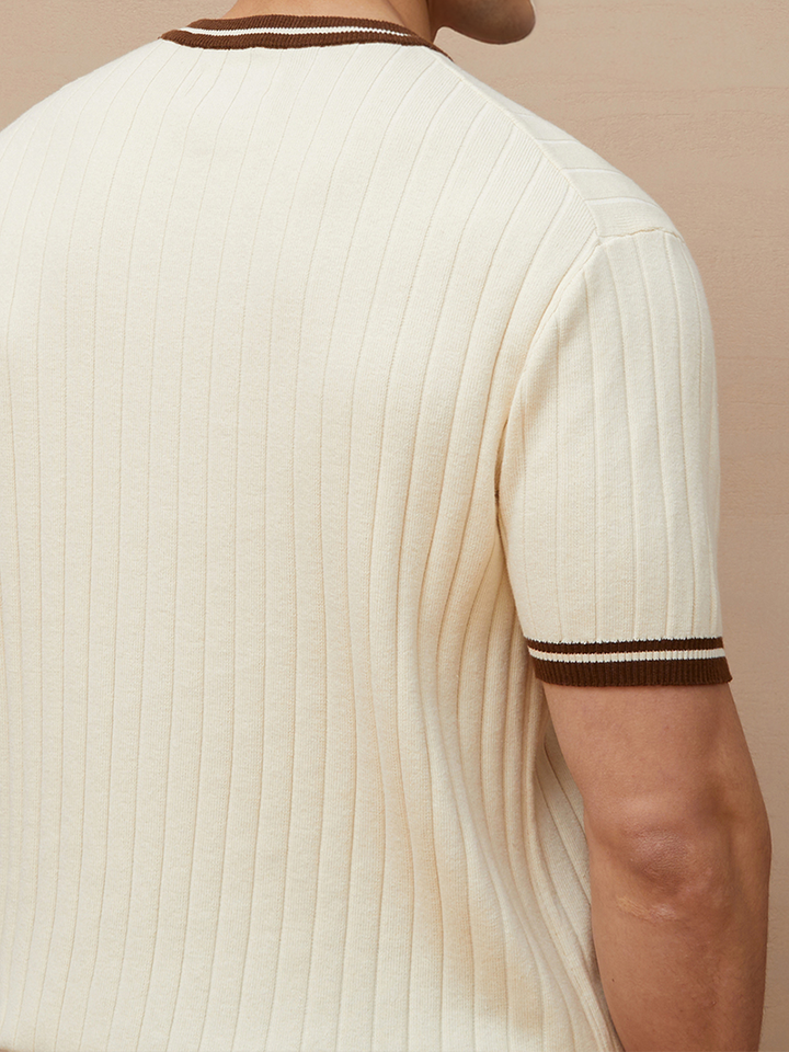 Comfortable men's ribbed knit polo shirt, short sleeve. Stylish beige top for casual wear.