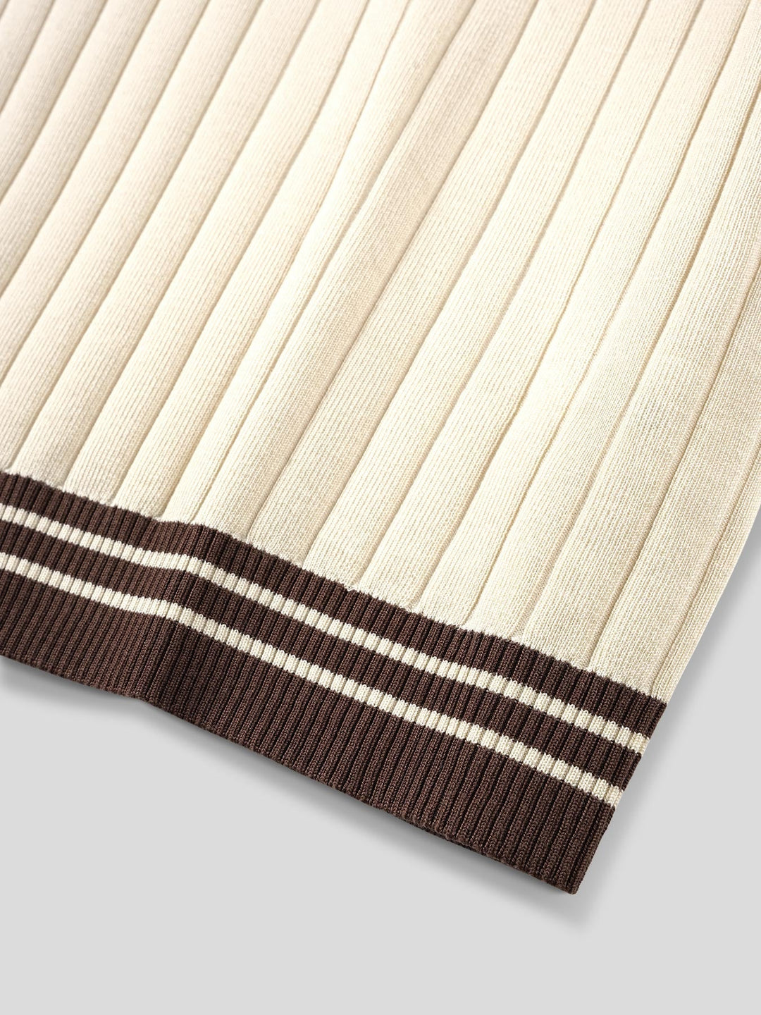 Stylish beige men's ribbed knit polo shirt, short sleeve with striped trim. Comfortable casual wear.