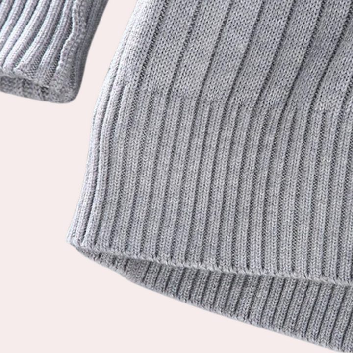 Close-up of the textured ribbed knit fabric on a men's full-zip casual jacket.