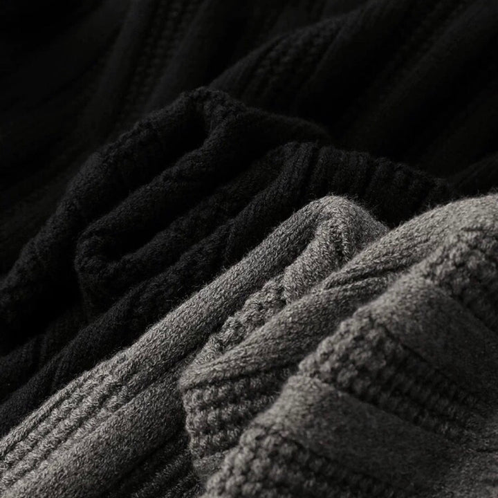Close-up of a men's ribbed knit sweater showcasing the intricate texture and classic polo collar design.