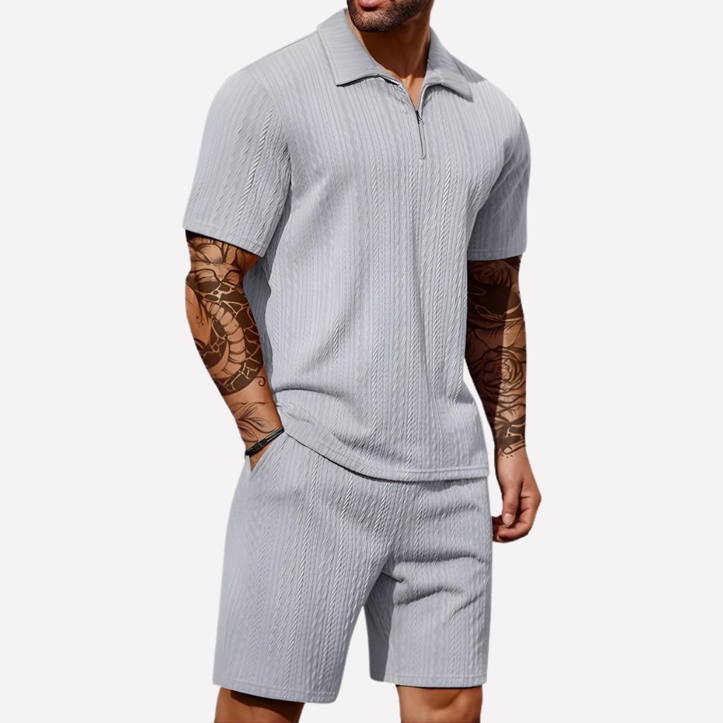 Stylish men's matching set: a ribbed half-zip polo and coordinating casual shorts for summer.