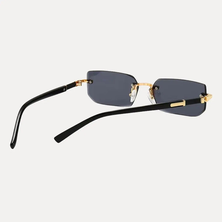 Modern men's rimless rectangle sunglasses with an elegant gold frame, offering a contemporary fashion statement.