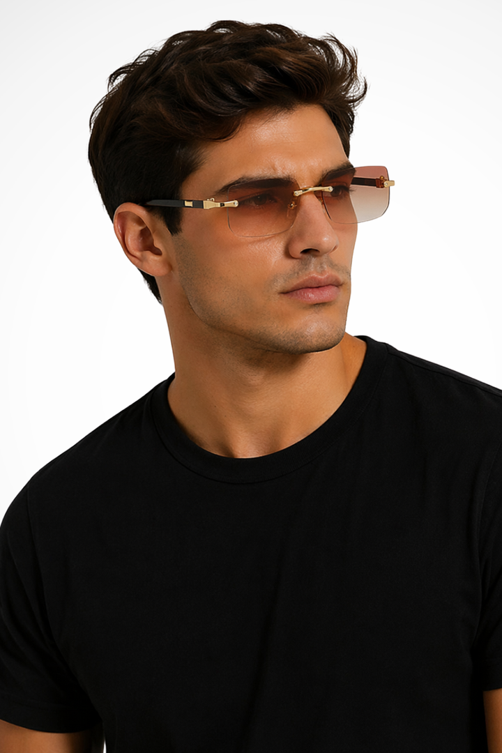 Close-up of men's rimless rectangle sunglasses, showcasing refined gold accent details.