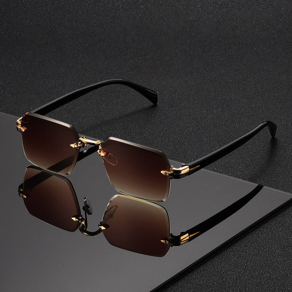Modern men's eyewear: rimless square glasses with a chic gold frame.