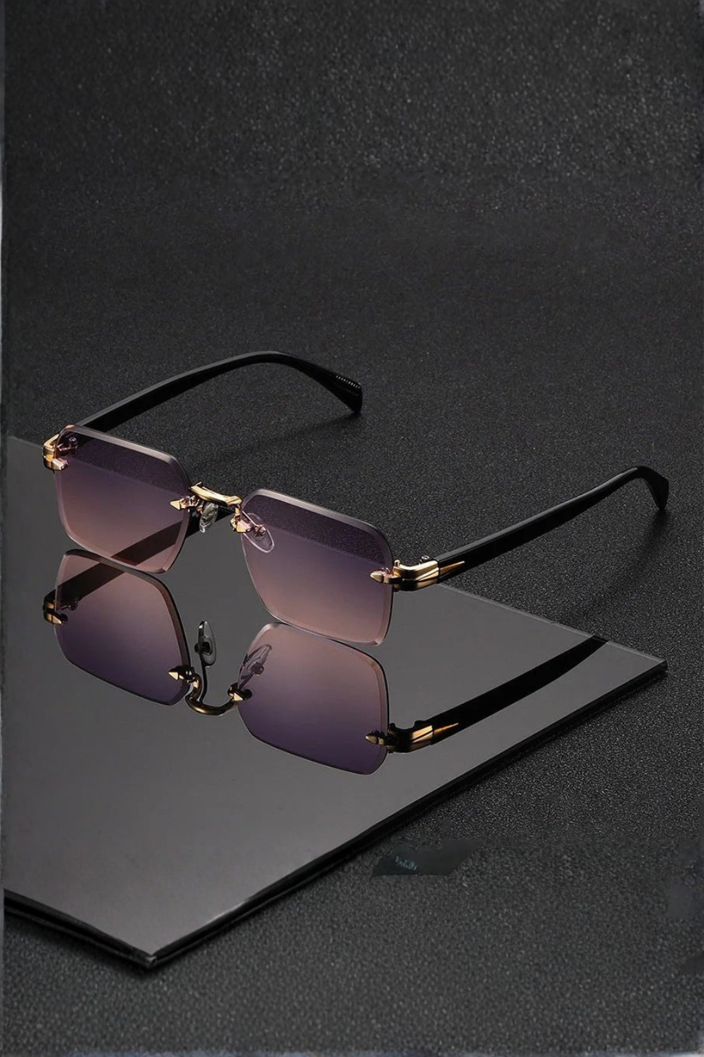 Men's stylish rimless sunglasses, gold bridge, gradient lenses. Modern, protective luxury eyewear.