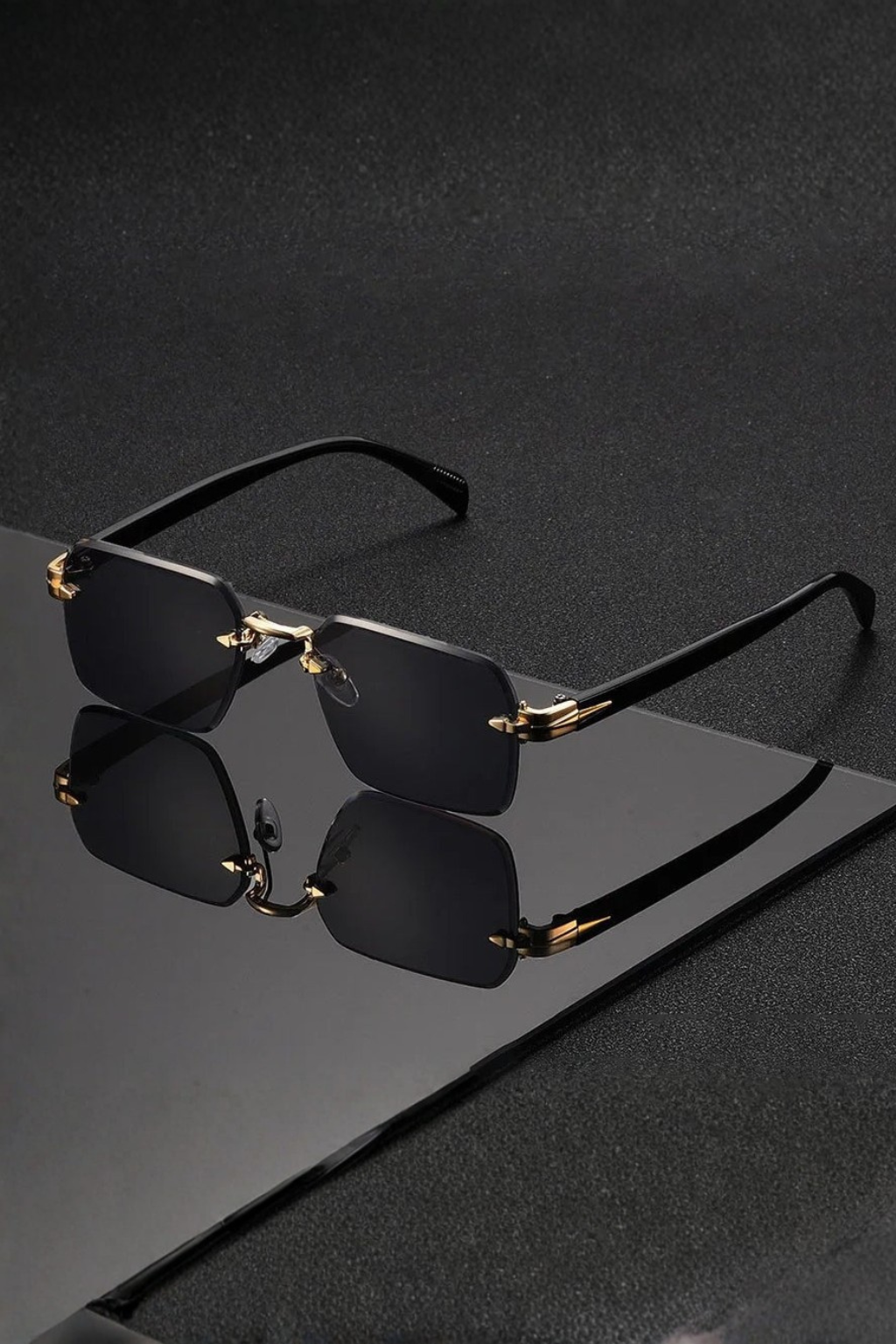 Elegant men's rimless sunglasses with a distinctive gold bridge & smooth gradient lenses.