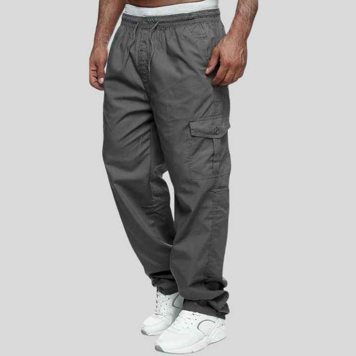 Rugged men's hiking pants; multi-pocket tactical cargo pants for outdoor adventures & heavy-duty work.