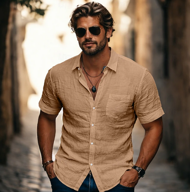 Achieve effortless style with this men's casual short sleeve button-down shirt.