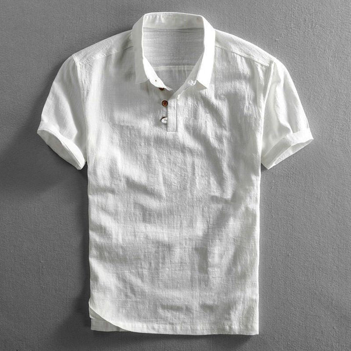 Stylish men's short sleeve polo shirt for warm weather, featuring a relaxed fit & classic button placket.