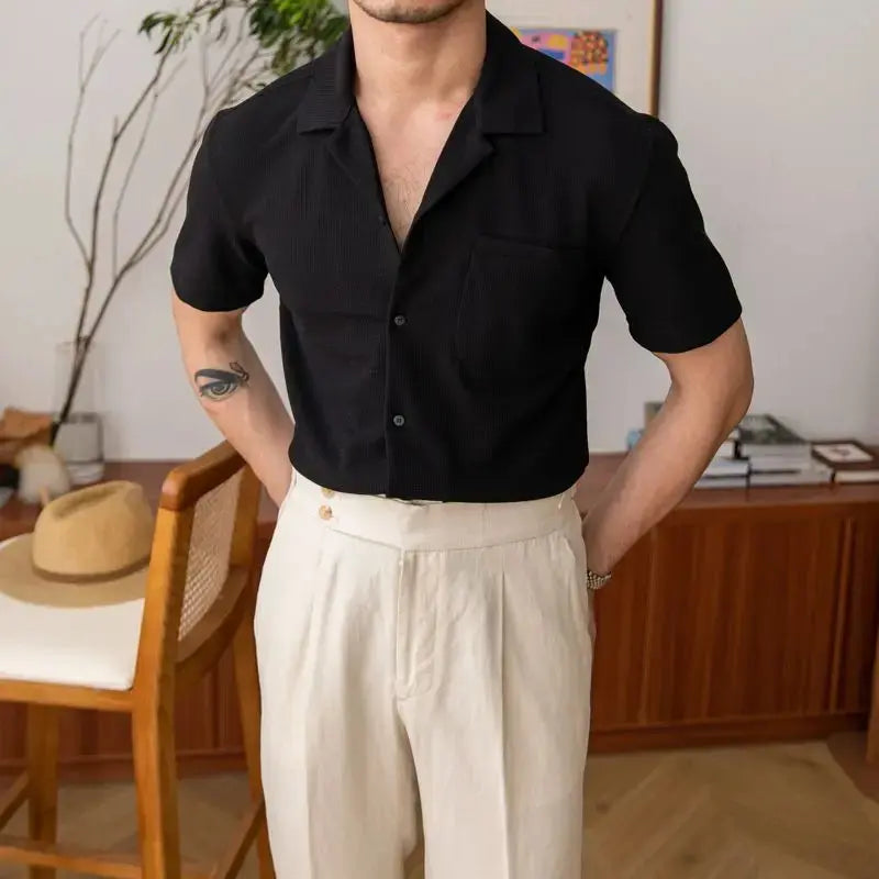 Textured men's short sleeve shirt with an open collar, ideal for casual and smart casual summer outfits. Versatile button-up.
