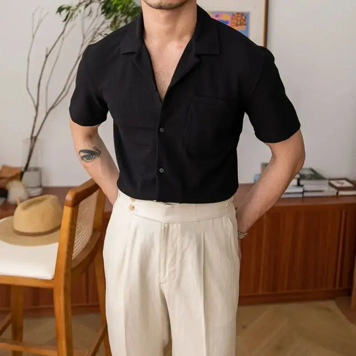 Textured men's short sleeve shirt with an open collar, ideal for casual and smart casual summer outfits. Versatile button-up.