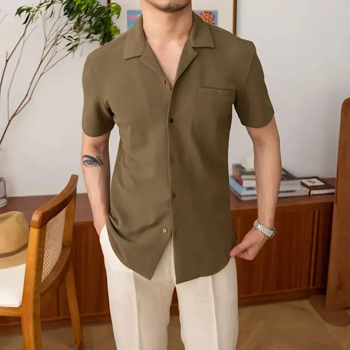 Modern men's short sleeve textured shirt with an open collar, great for comfortable summer fashion and everyday casual wear.