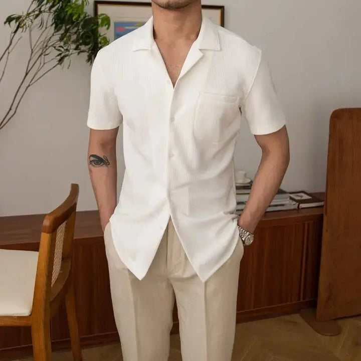 Stylish men's short sleeve textured shirt, an open collar button-up designed for smart casual and summer fashion versatility.