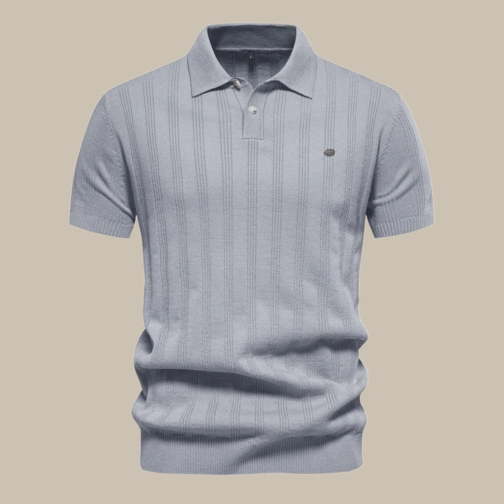 Model wearing a men's breathable short sleeve knit polo shirt