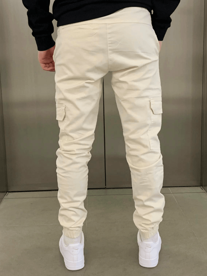 Modern men's sleek joggers with cargo pockets and a comfortable tie-waist closure.