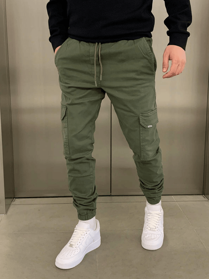 Men's fashionable cargo trousers, offering a sleek look and adjustable tie-waist for comfort.