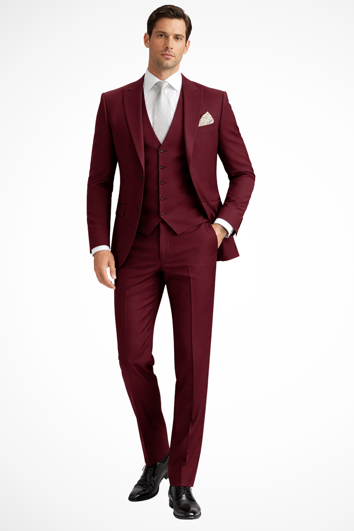 Sharp burgundy men's slim fit 3-piece suit, peak lapel. Perfect for a party or formal event.