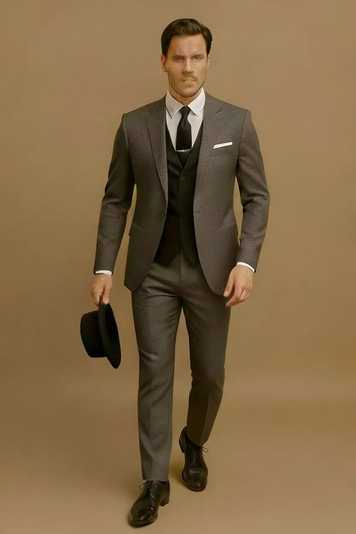 Close-up: Men's slim fit 3-piece suit details, showing tailored jacket, waistcoat & fine fabric texture.