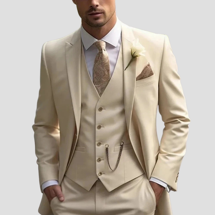 Full shot of a groom wearing a slim fit tailored formal suit for a wedding.