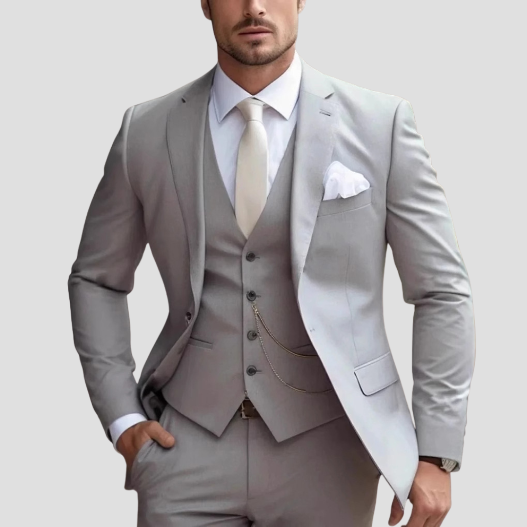 Model posing in a sharp men's formal business attire, three-piece suit set.