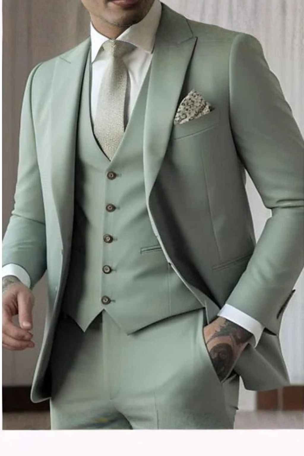 Close-up of a sophisticated men's 3-piece slim fit suit, highlighting the classic peak lapel design.