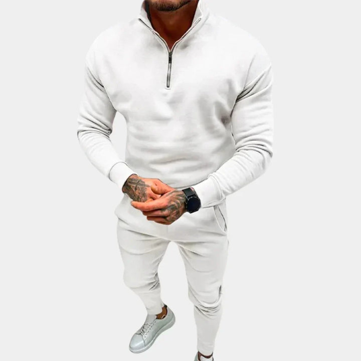 Modern men's active tracksuit, slim-fit design for athletic performance or stylish casual wear. Half-zip & elastic waist.