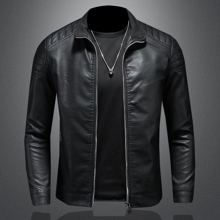Blue men's slim-fit casual jacket with quilted shoulders, a stand collar, and modern outerwear style.