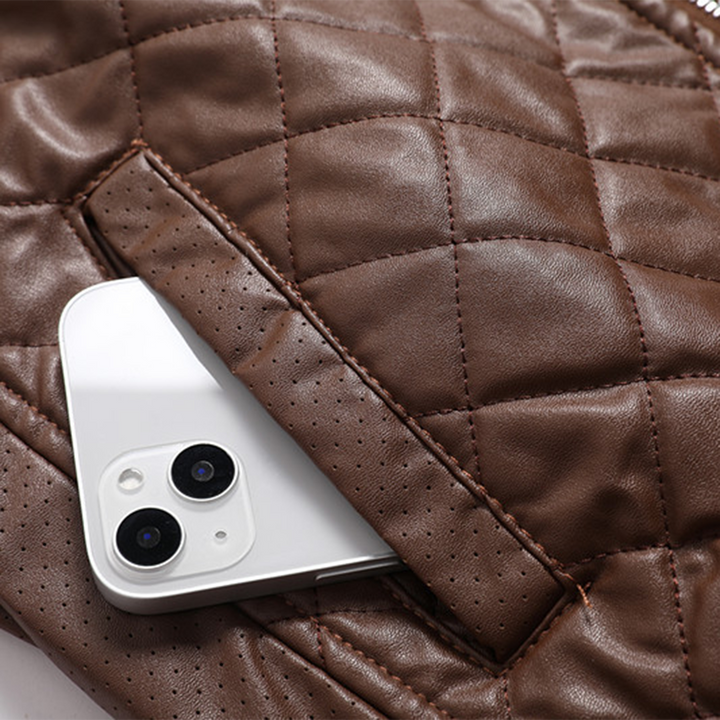 Back view of a men's durable leather jacket, highlighting its cut.