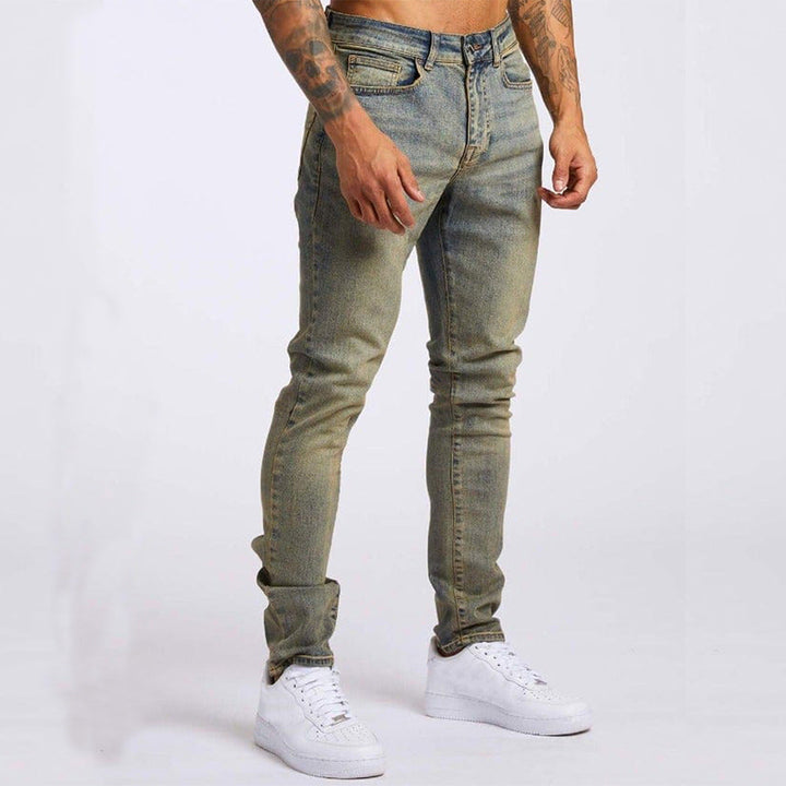 Man's slim fit jeans in classic blue denim, versatile for everyday streetwear