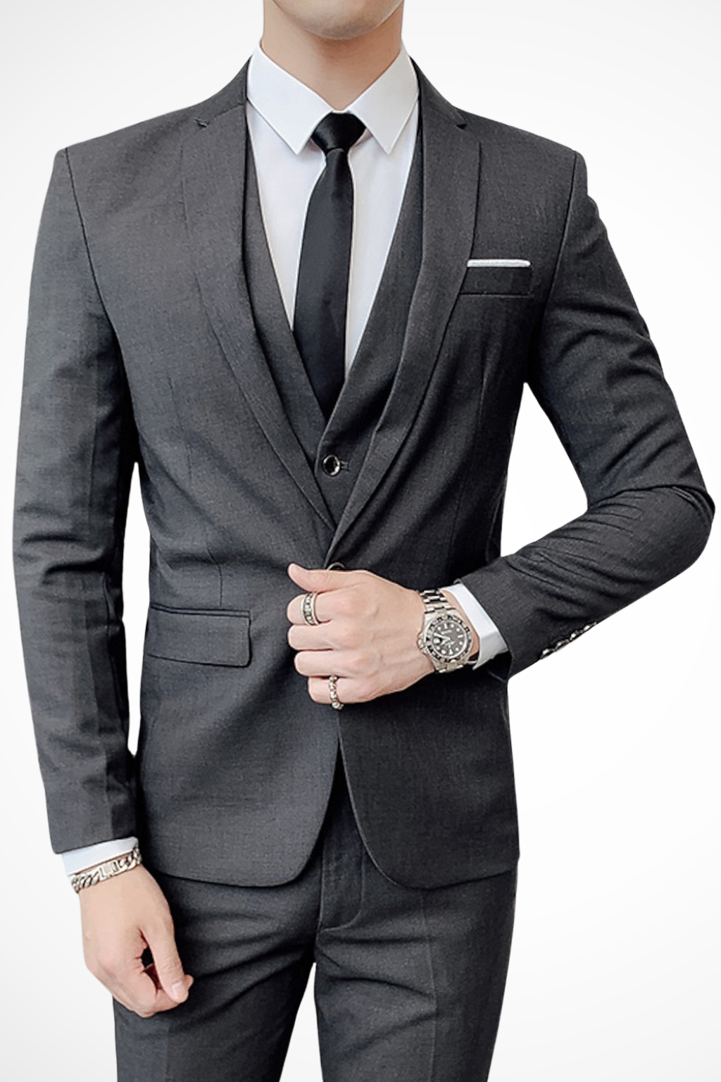 Model showcasing a modern men's black notch lapel suit, perfect wedding guest attire.