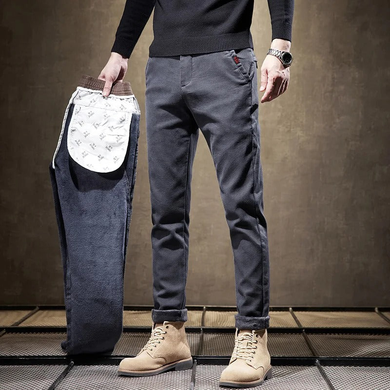 Model wearing modern men's slim-fit casual pants, demonstrating sleek fit and versatile style.