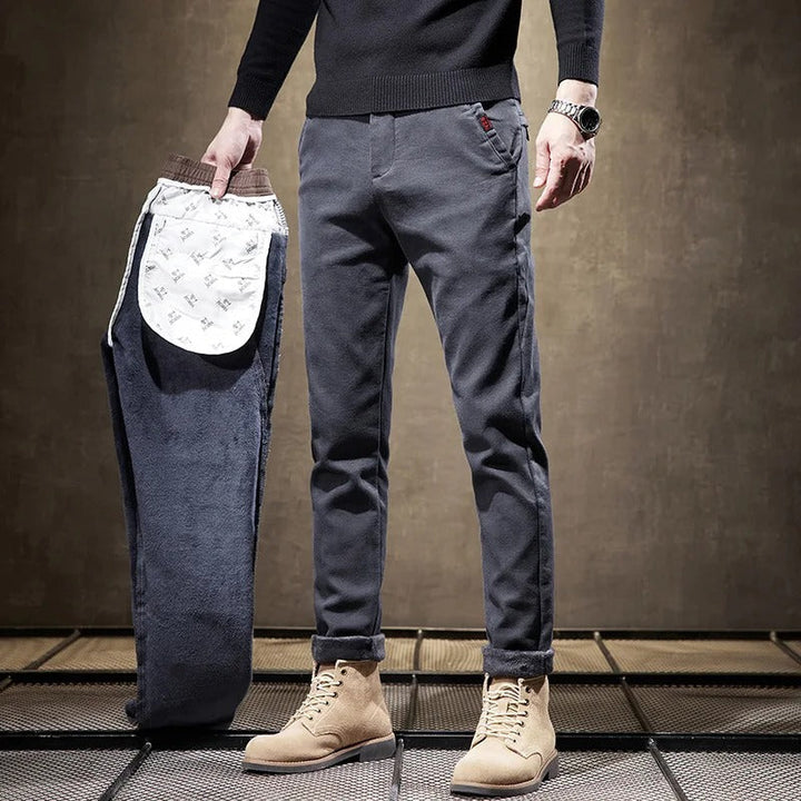 Model wearing modern men's slim-fit casual pants, demonstrating sleek fit and versatile style.