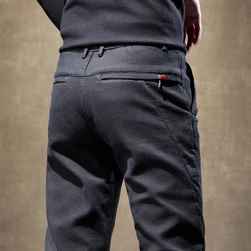 Collection of men's slim-fit casual pants in khaki, grey & black, showcasing versatile modern comfort.