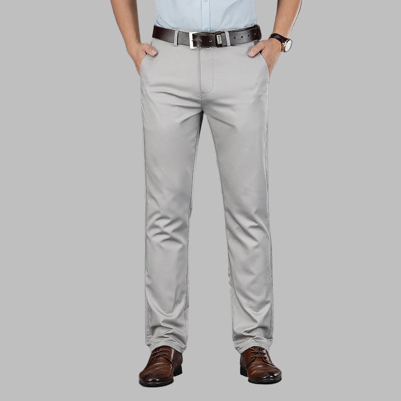 Man modeling slim fit chinos, demonstrating their comfortable fit and modern style for a smart casual appearance.
