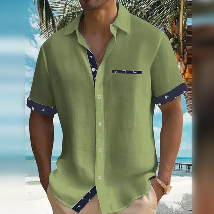 Men's slim fit classic button-down shirt in a versatile solid color, perfect for casual or dressy occasions.