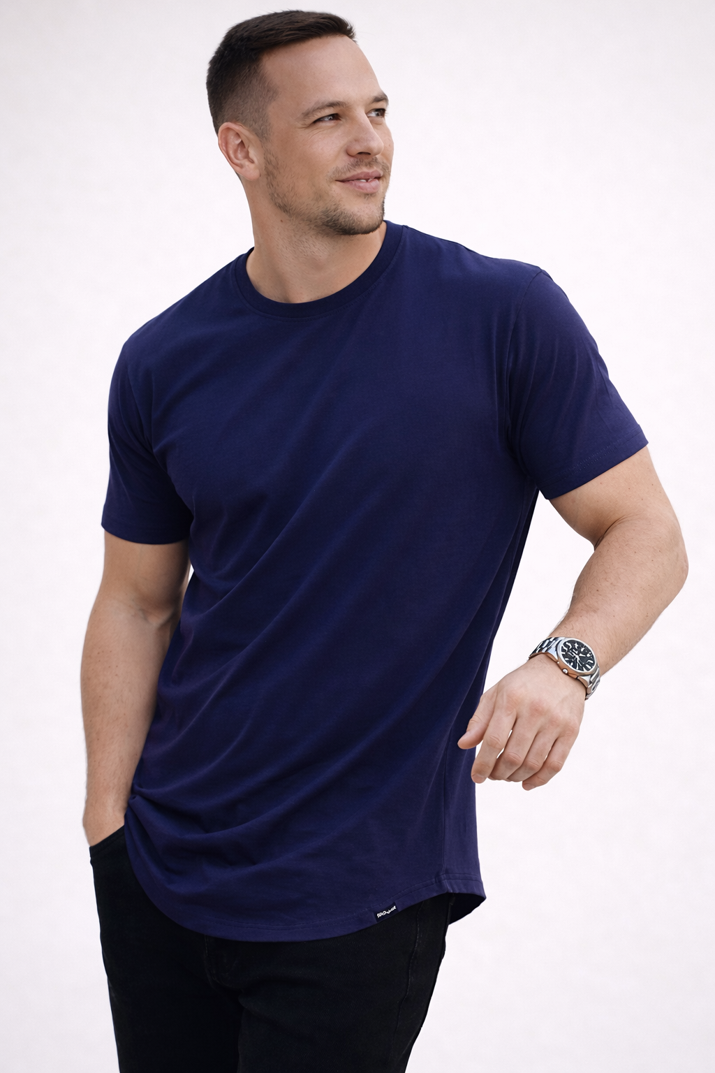 Wardrobe essential: a neatly folded men's short sleeve t-shirt in a neutral color.