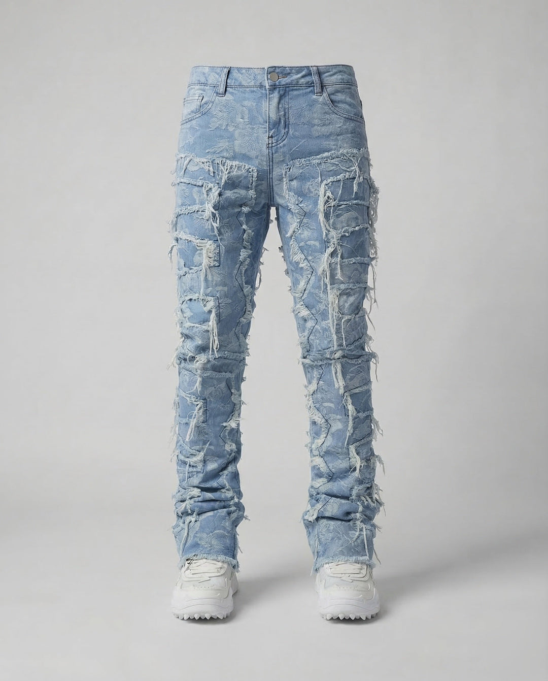 Men's slim fit destroyed jeans, a staple for streetwear and festival outfits, showcasing distressed denim.