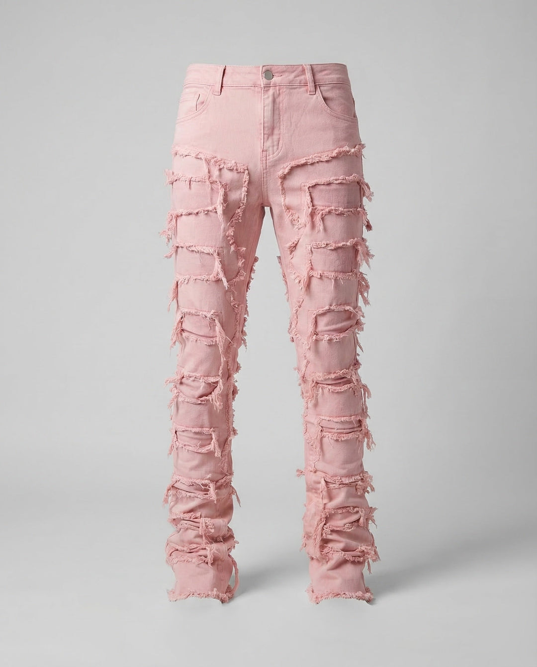 Close-up of ripped details on men's slim fit jeans, a key element for an edgy streetwear outfit.
