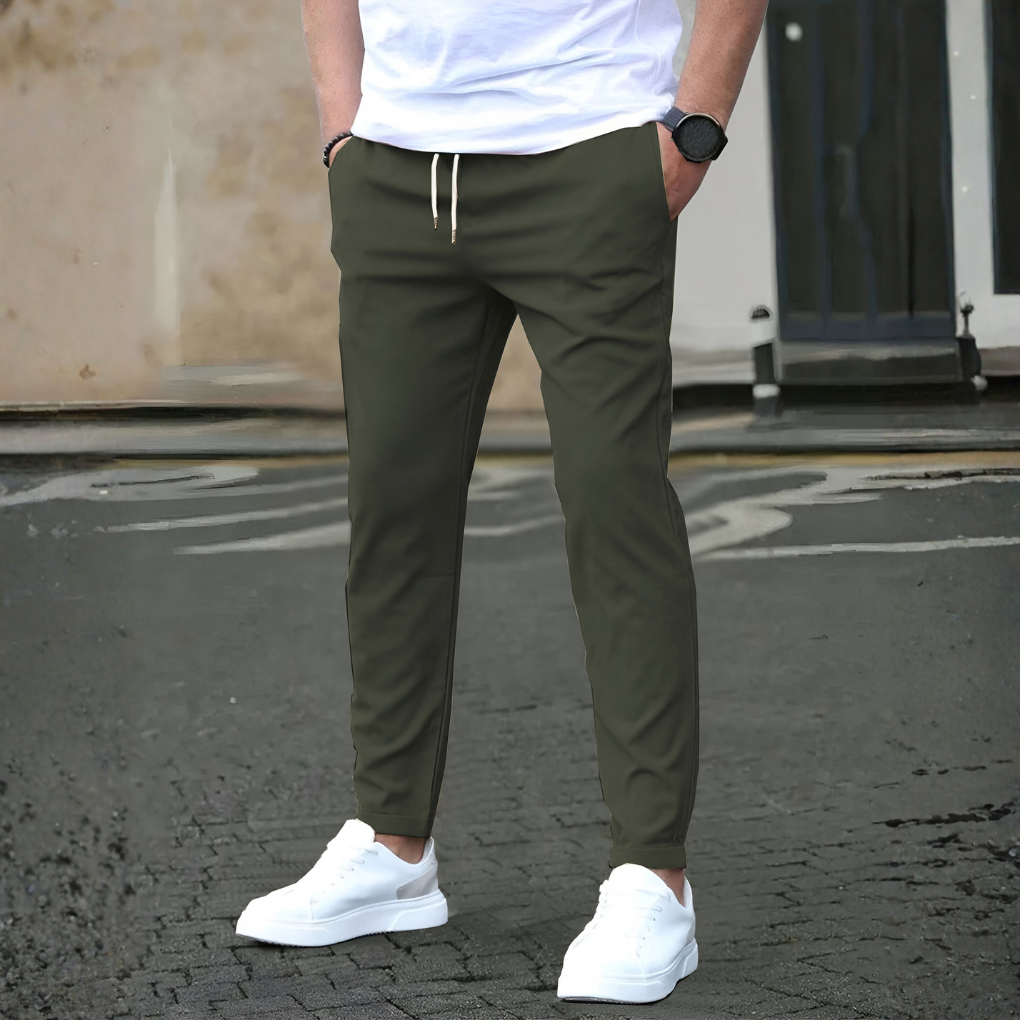 Versatile men's travel pants, slim fit design with drawstrings for all-season comfort.