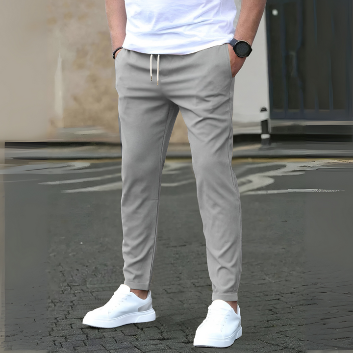 Men's gym wear pants, slim fit and breathable, with a secure drawstring waistband.