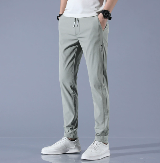 Men's slim fit gray jogger pants with drawstring waist, ideal for casual wear or athletic activities.