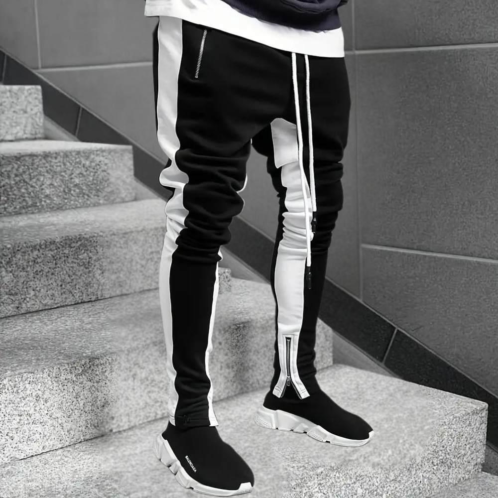 Comfortable men's slim fit casual joggers with unique contrast panels & adjustable zip cuffs for a modern, active look.