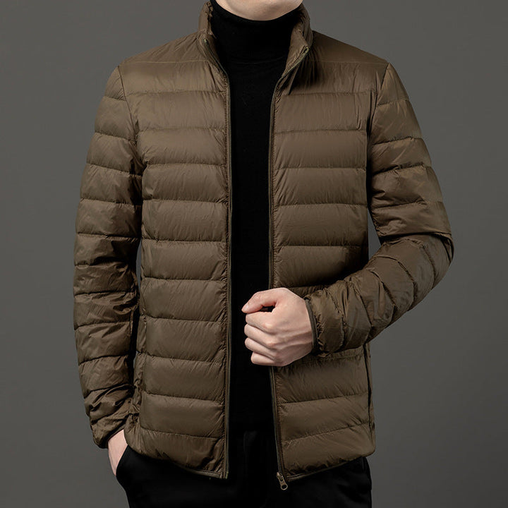 Stylish men's quilted puffer jacket with stand collar, perfect for fall/winter.