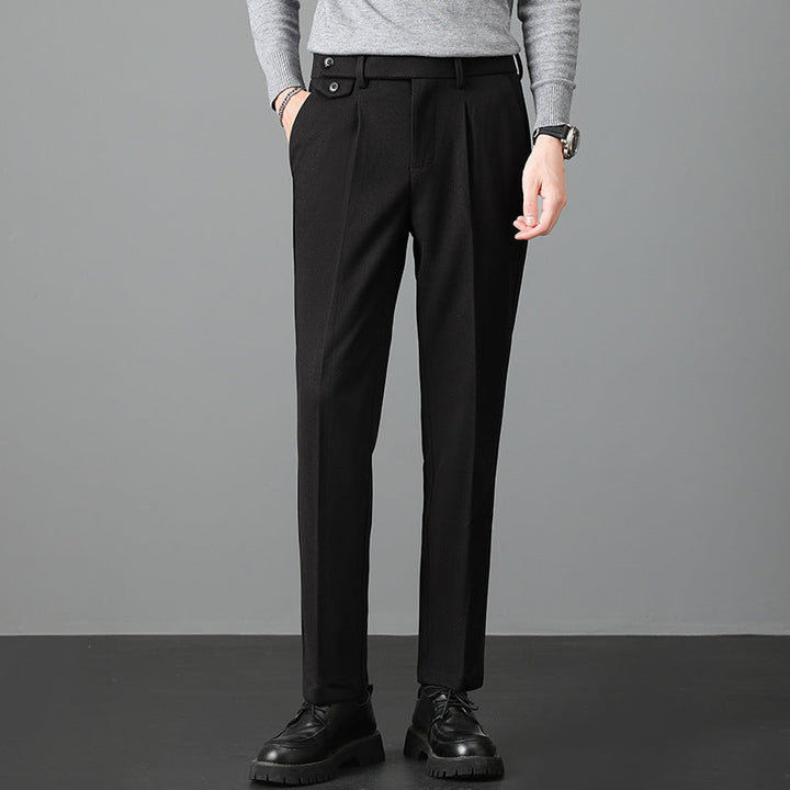 Man models stylish men's slim fit dress pants in a classic color, showcasing tailored fit for business & formal wear.