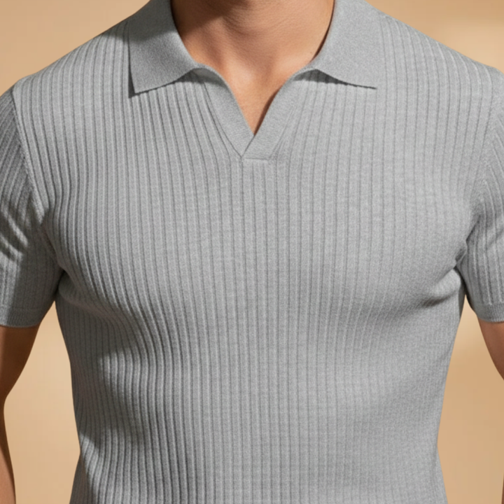 Sophisticated men's polo shirt with ribbed fabric and slim fit, offering contemporary style.