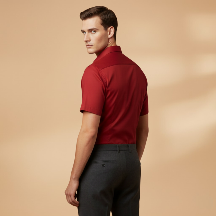 Back view of a black slim fit short sleeve button-down shirt, highlighting the tailored cut.