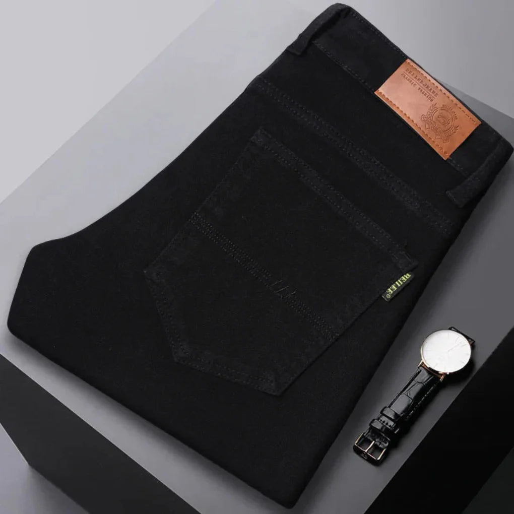Detail shot of the stretch fabric in men's slim fit jeans, emphasizing comfort and flexibility.