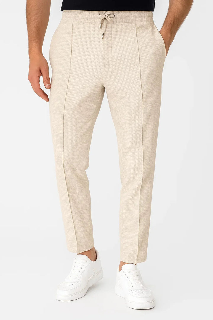 Smart casual men's textured slim fit pants with an adjustable drawstring waist.