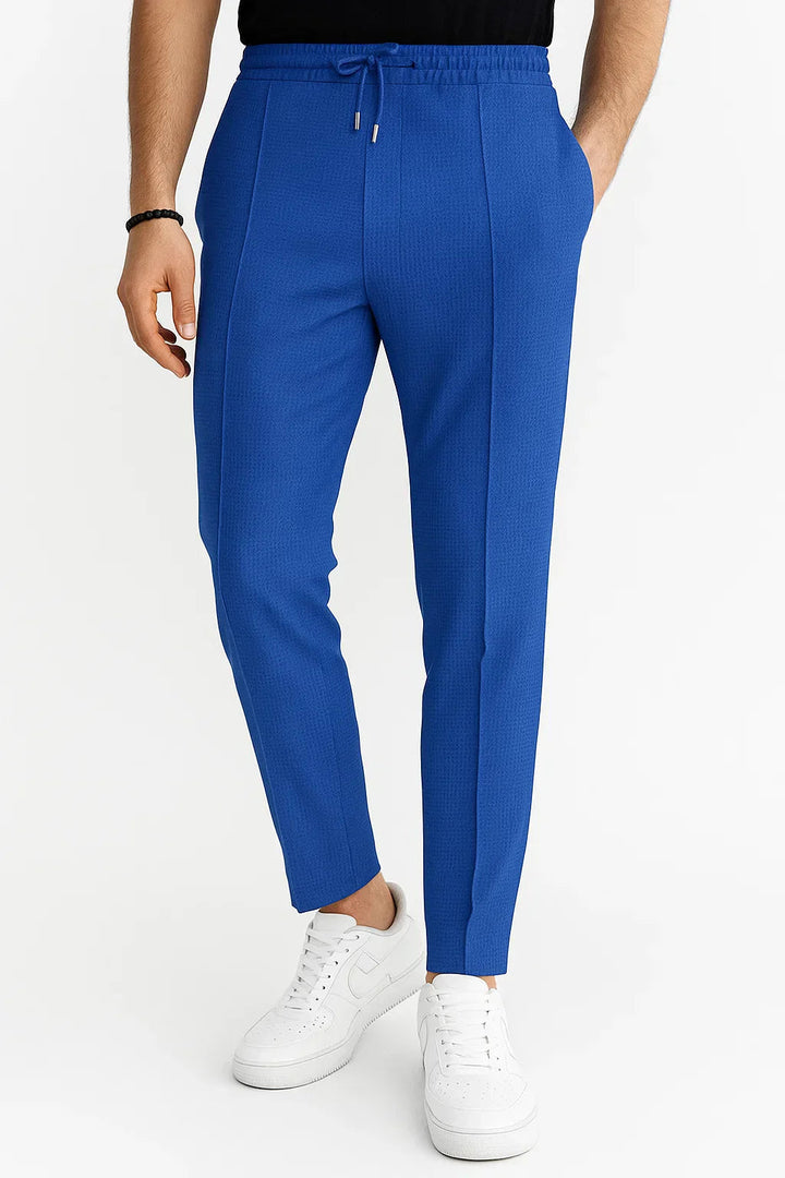 Casual men's textured trousers, slim fit cut with practical drawstring waist, comfortable apparel.